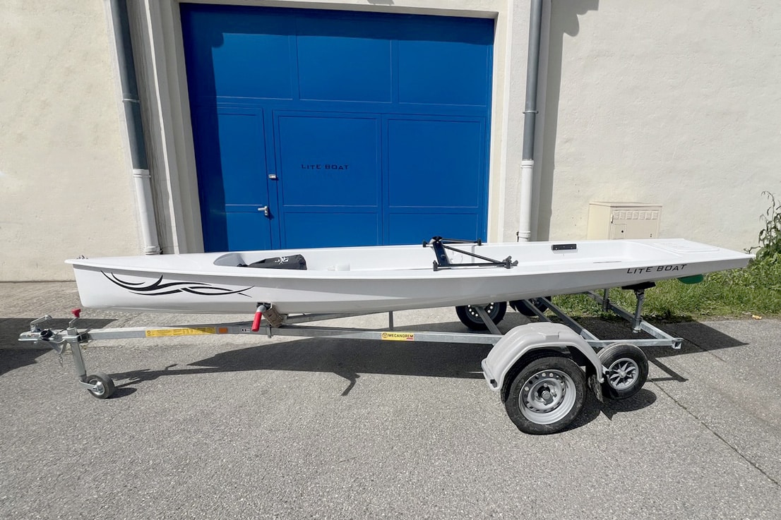 X Row Liteboat on road trailer